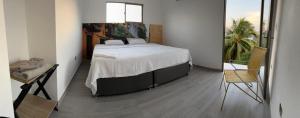 Un pat sau paturi într-o cameră la Apartamento Cómodo y encantador en cartagena