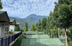 a group of green steps with mountains in the background at Alinson Sunset Hill in Bogor