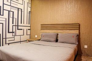 Postel nebo postele na pokoji v ubytování Classical Boutique Hotel