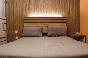 Postel nebo postele na pokoji v ubytování Classical Boutique Hotel