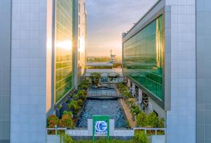 a view from the top of a building with a pool at Claro Hotel Kendari in Kendari