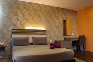 Postel nebo postele na pokoji v ubytování Classical Boutique Hotel