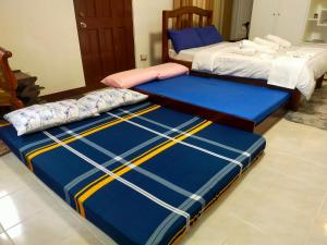 Cama o camas de una habitación en Relaxing and Cozy Studio Type House in Bacolod