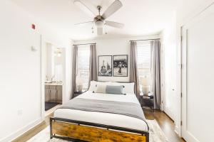 a bedroom with a bed and a ceiling fan at Urban Escape in Nashville