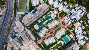 an overhead view of a city with buildings and a pool at InterContinental Phuket Resort by IHG in Kamala Beach