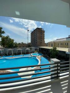 a large swimming pool on top of a building at Deluxe Ferghana Hotel in Fergana