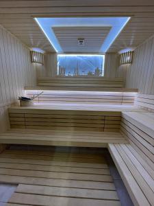 a sauna with a view of a city in the background at Mir Luxe Plaza in Tashkent