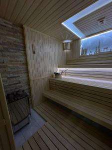 a room with a sauna with a window in it at Mir Luxe Plaza in Tashkent