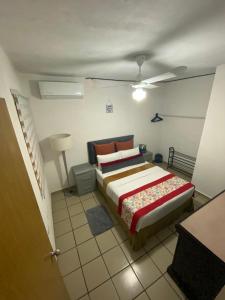 a bedroom with a large bed in a room at Departamento Vallarta in Puerto Vallarta