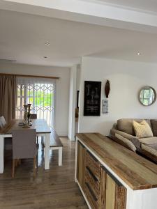 a living room with a couch and a table at The Runway Lodge in Pointe Larue