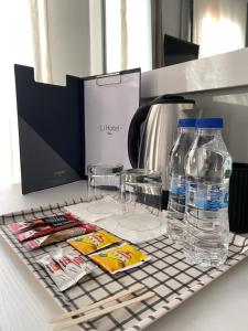 a counter with two bottles of water and glasses at Li Hotel Pera in Istanbul