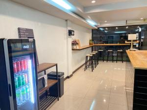 a drink machine in a restaurant with a bar at THE BEST ONE CHIANG MAI in Chiang Mai