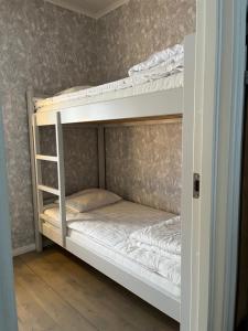 a couple of bunk beds in a room at Helsingegården in Järvsö