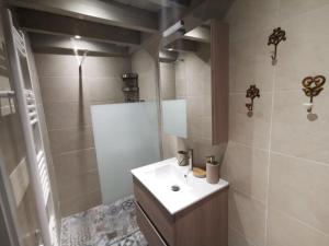 a bathroom with a sink and a shower at Casa Carina, Arachova in Arachova