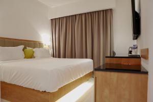 Postel nebo postele na pokoji v ubytování D Loft Hotel