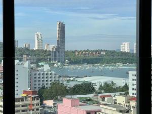 a view of a city with a harbor and buildings at EDGE Central Pattaya in Pattaya
