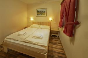 Postel nebo postele na pokoji v ubytování Rute Hotel and Apartments