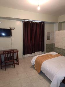 Cama o camas de una habitación en Sislink Hotel