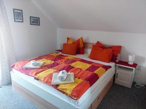 a bedroom with a large bed with towels on it at Waldhaus in Sankt Martin am Tennengebirge