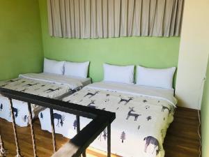 Postel nebo postele na pokoji v ubytování Taroko Mountain View B&B