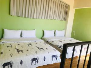 Postel nebo postele na pokoji v ubytování Taroko Mountain View B&B