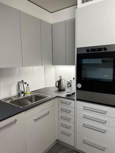 Kuchyň nebo kuchyňský kout v ubytování Charmante und zentrale Wohnung am Weiherpark Arbon + 24 fotografií