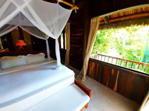 Ein Bett oder Betten in einem Zimmer der Unterkunft Ocean Bay Resort & Spa Phu Quoc