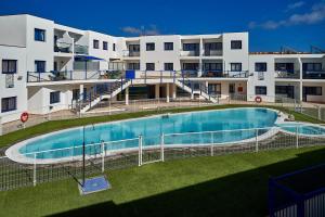 a large swimming pool in front of a building at CostaSun and Pool in Costa Calma