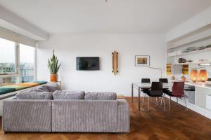 a living room with a couch and a table at Cozy Stay Rotterdam City in Rotterdam