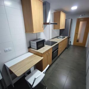 Kuchyň nebo kuchyňský kout v ubytování Apartamentos Motilla del Azuer