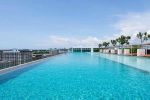 a large swimming pool on the roof of a building at SA Sutera Avenue Homestay Kota Kinabalu Area KK City Opposite Imago in Kota Kinabalu