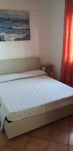 1 dormitorio con 1 cama en una habitación en Villa Sorrentina, en Alghero