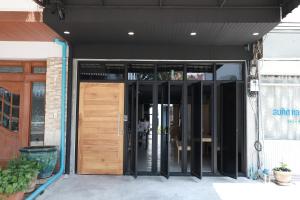 an entrance to a building with a wooden door at The Cube Hostel Khaosan in Bangkok