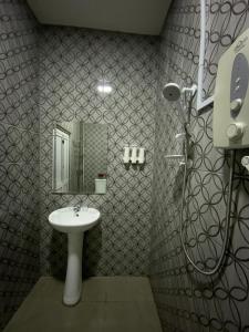 a bathroom with a sink and a shower at SBS HOTEL in Padang Besar +20 photos