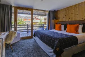 Postel nebo postele na pokoji v ubytování M de Megève