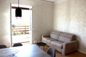 a living room with a couch and a table at L'angolo di Greta in Rome