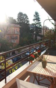 a balcony with a table and a view of a city at L'angolo di Greta in Rome