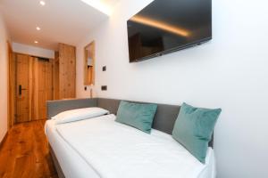Voodi või voodid majutusasutuse Bepy Hotel Garni toas