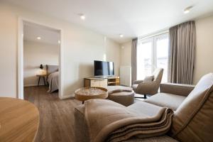 Televisyen dan/atau pusat hiburan di My Suite Leesch - Hotel & Restaurant nahe Büsum - Hunde herzlich willkommen