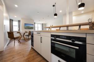 Dapur atau dapur kecil di My Suite Leesch - Hotel & Restaurant nahe Büsum - Hunde herzlich willkommen