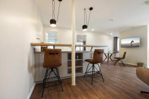 Televisyen dan/atau pusat hiburan di My Suite Leesch - Hotel & Restaurant nahe Büsum - Hunde herzlich willkommen