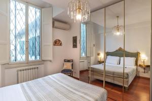 מיטה או מיטות בחדר ב-MDR Antinori Apartments