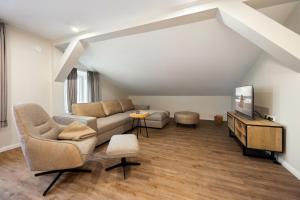 Ruang duduk di My Suite Leesch - Hotel & Restaurant nahe Büsum - Hunde herzlich willkommen