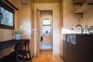 a small kitchen with a sink and a counter at White House Hideaway in Brockhampton +66 photos