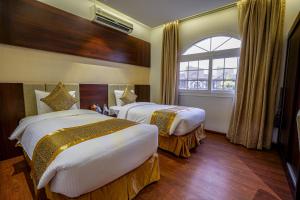 Postel nebo postele na pokoji v ubytování Meral Oasis Resort Taif