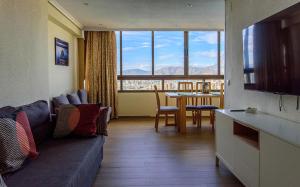 a living room with a couch and a table at Sun&Beach View Apartments in Benidorm