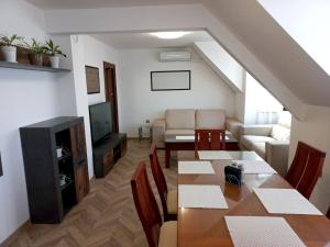 a living room with a dining table and a living room at APARTMENT TONI / 2BEDROOMS in Varna City