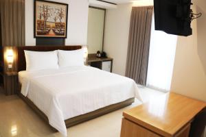 Katil atau katil-katil dalam bilik di Surabaya River View Hotel