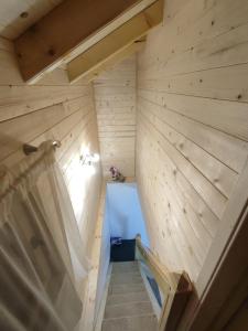 an overhead view of a bathroom with wooden walls at Vila Helena in Kolašin