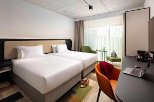 Łóżko lub łóżka w pokoju w obiekcie Hyatt Place Krakow